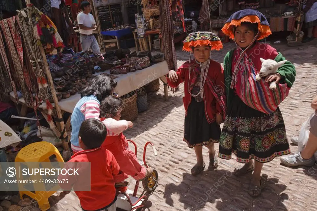 Girls in Pisac Market. Sacred Valley. Cusco Departament. Peru.