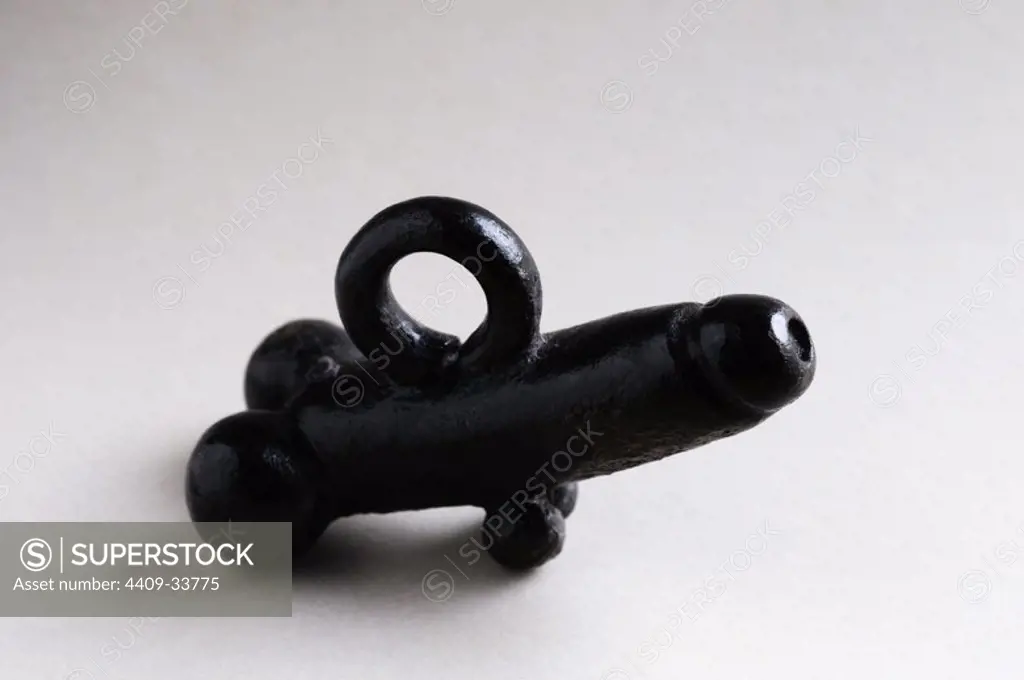 Phallic pendant of bronze ( Amulet ). Length 34 mm Height 22 mm Width 7 mm ( 1 St - 3 rd CE ) - Roman period, from the " House of Hyppolytus "- Archaeological site of Complutum in Alcalá de Henares ( Madrid ). SPAIN.