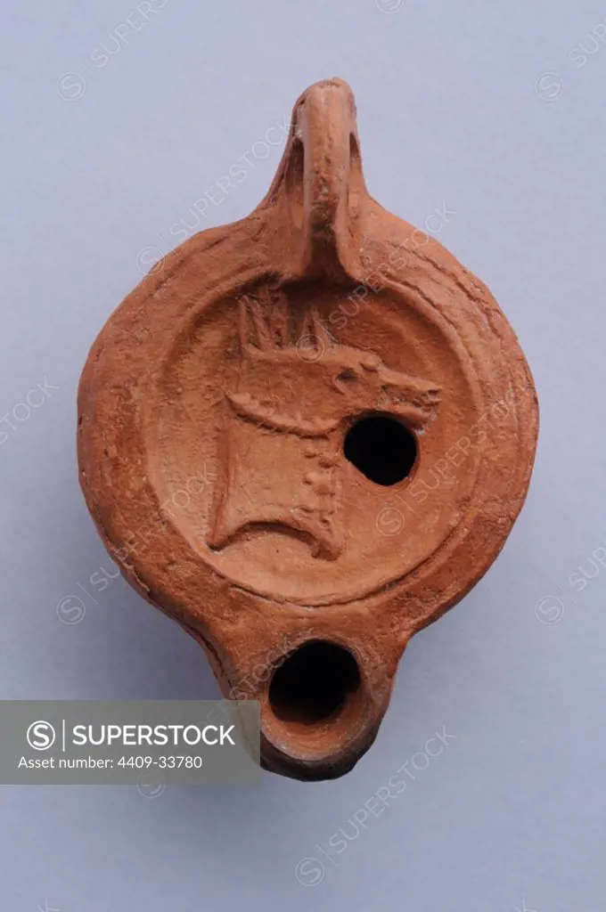 Disc oil- Lamps decorated with embossed horse. 7.2cm x 5 cm ( 1st- 2nd CE) - Roman period , from the archaeological site of Complutum in Alcala de Henares ( Madrid ). SPAIN.