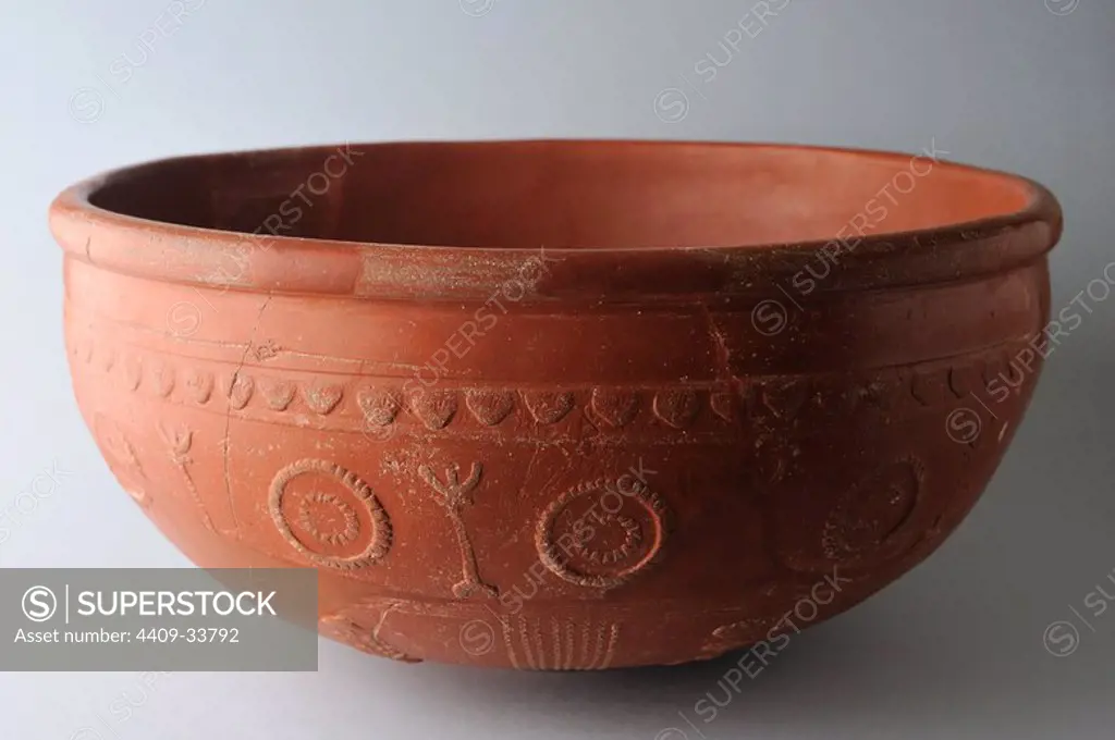 Ceramic Bowl "Terra Sigillata Hispanic" type Drag 37 with geometric decoration in concentric circles . Dimensions 20 cm x 12 cm. ( 2 nd CE )- Roman period, from the archaeological site of Complutum in Alcala de Henares ( Madrid ). SPAIN.