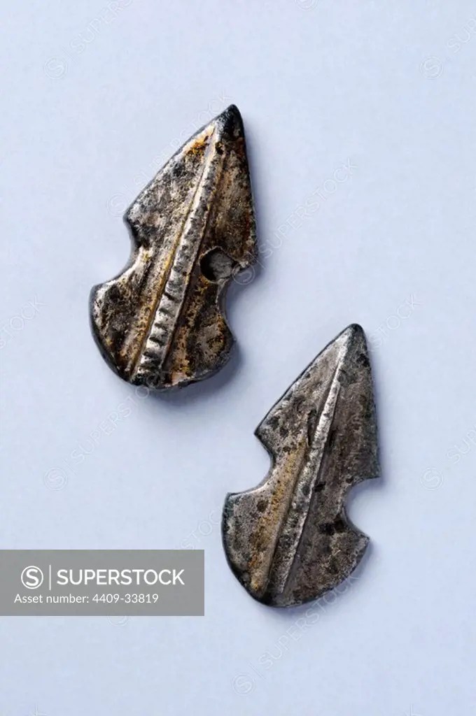 Silver belt ornaments with violin-shaped and striated central midrib.Length 3 cm Width 1, 5 cm Thickness 0, 4 cm (6 th - 7 th CE )- Visigoth period, from the "Afflicted Necropolis "- Archaeological site of Complutum in Alcalá de Henares ( Madrid ). SPAIN.