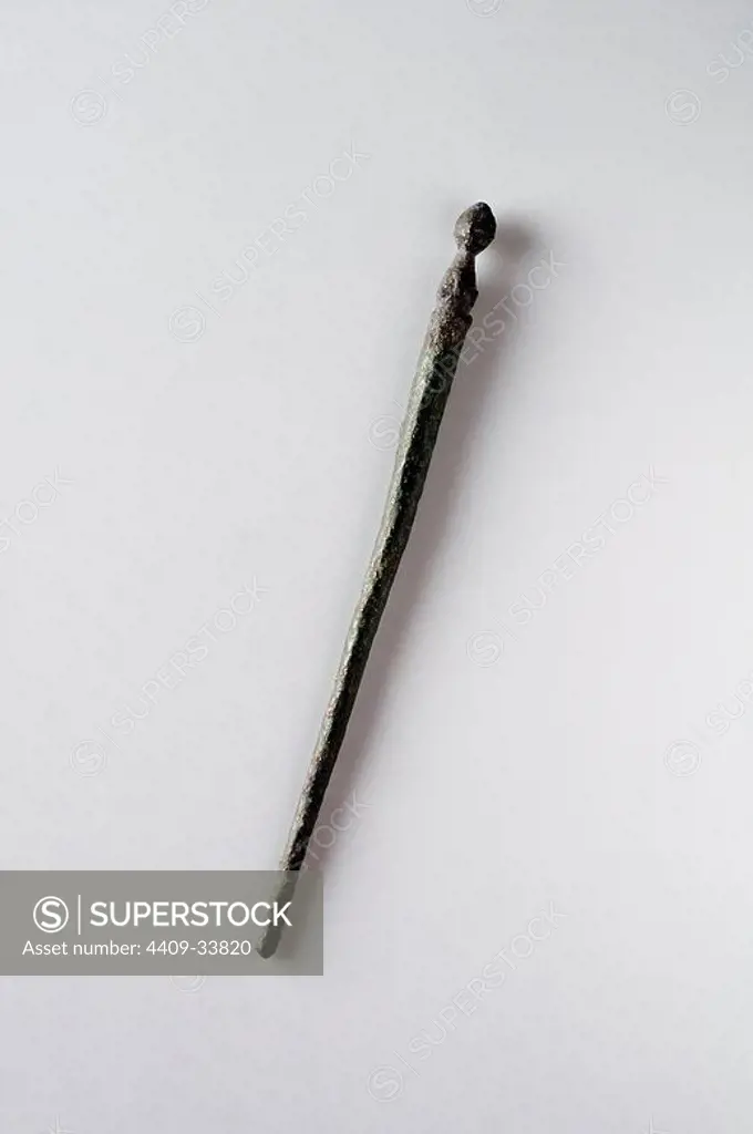 Hair needle in bronze. Length 81 mm (1 St - 4 Th Ce )- Roman period, from the " Miracle Wall " ( Martyrdom of Saints Children ; Justo y Pastor ) -Archaeological site of Complutum in Alcala de Henares (Madrid). SPAIN.