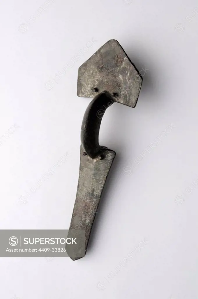 Bronze Fibula arc trilaminar,consists of three pieces hammered together by nails .Size 10, 2 cm x 3, 1 cm Height 2 cm ( 5 th CE ) - Visigoth period, from the "Afflicted Necropolis "- Archaeological site of Complutum in Alcalá de Henares ( Madrid ). SPAIN.