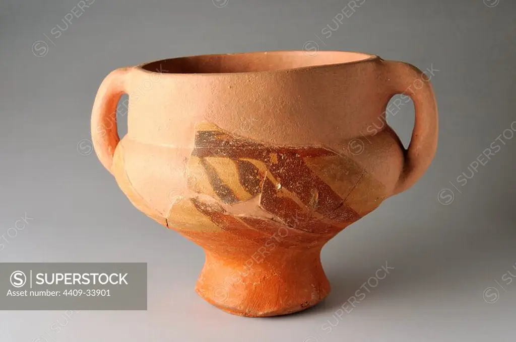 Repopulation Cup with two handles ,engalba thatched upper with a series of four strokes. Height 89 mm Width 107 mm Thickness 4 mm (12 th- 13 th CE ) - Medieval period belonging of the " Burgo de Santiuste Museum" in Alcalá de Henares. (Madrid). SPAIN.