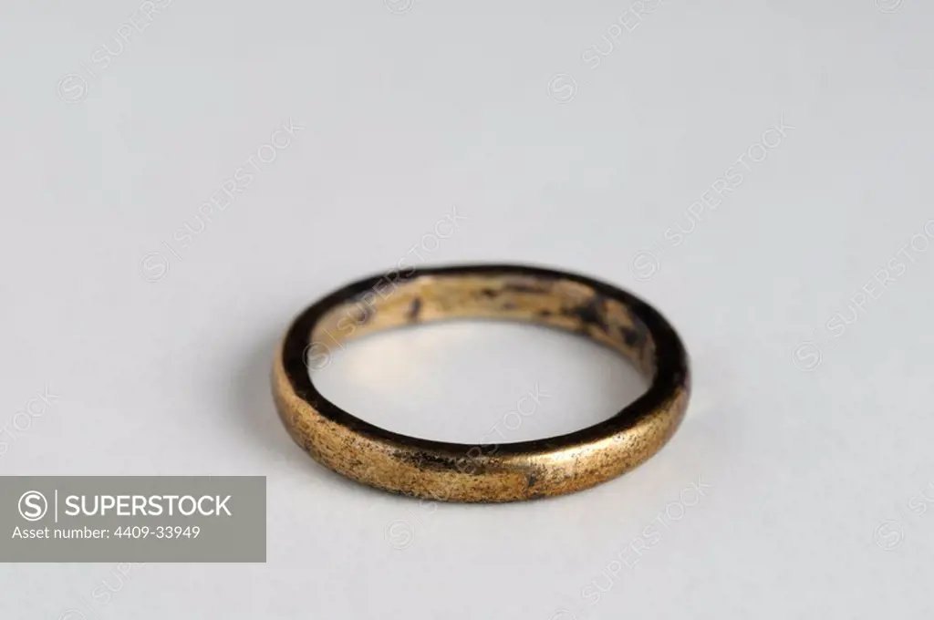 Silver ring with gold plated. Diameter 0,90 mm Width: 0, 30 cm. (1st - 4 th CE ) - Roman period, from the " Villa del Val" - Archaeological site of Complutum in Alcalá de Henares ( Madrid ). SPAIN.