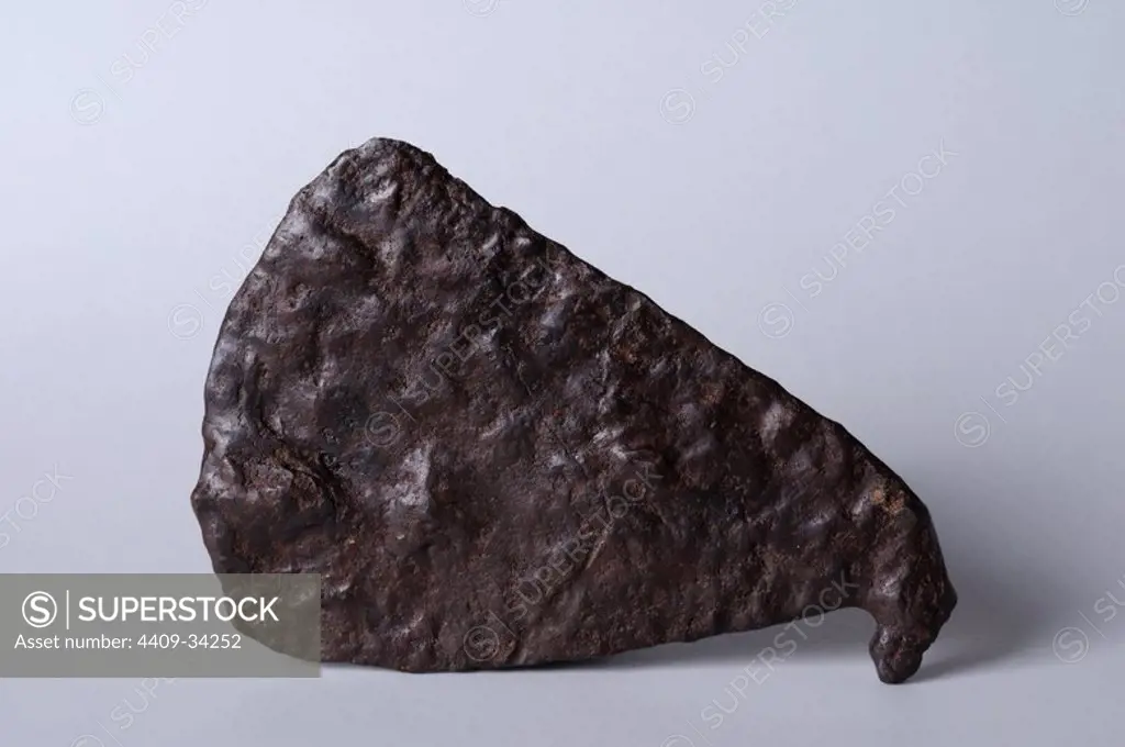 Iron Axe. Length 10 cm Width 6, 7 cm Thickness 7 mm. (4 th - 8 th CE ) - Hispanicroman period from the " Villa del Val" - Archaeological site of Complutum in Alcalá de Henares ( Madrid ). SPAIN.