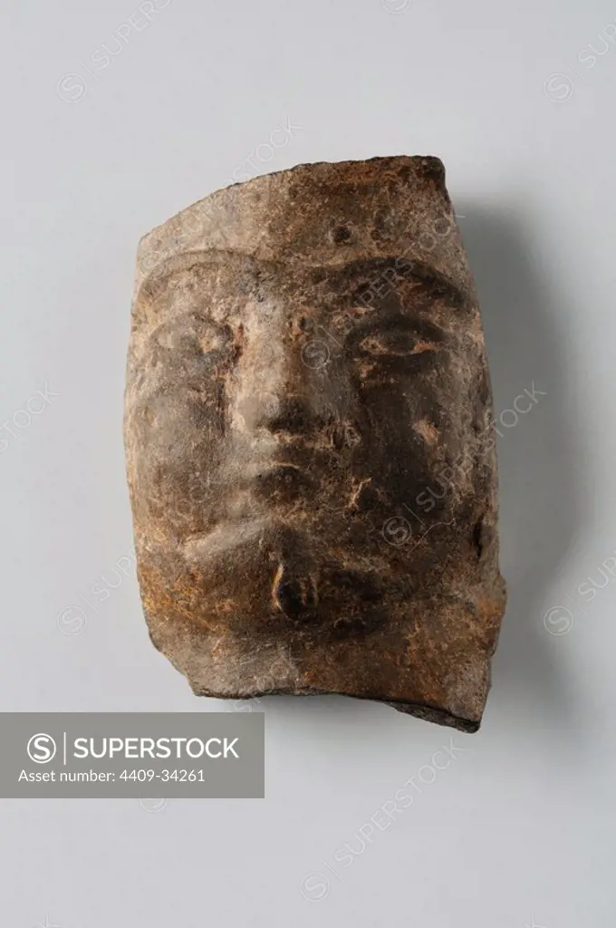 Male head of terracotta figurine. Height 4, 1 cm width 2.2 cm (1 st - 3 rd CE ) - Roman period from archaeological site of Complutum in Alcalá de Henares ( Madrid ). SPAIN.