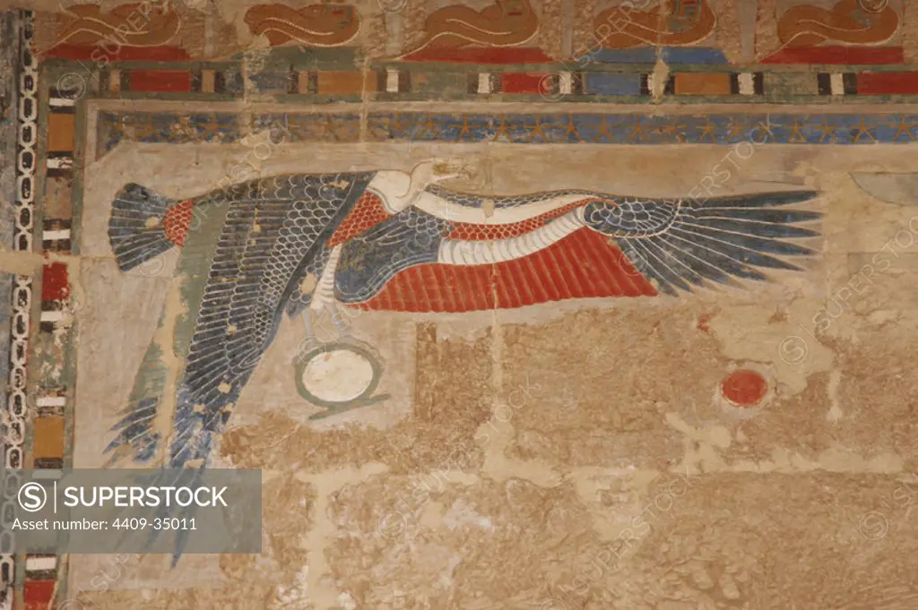 Vulture Nekhbet opening their protective wings. Polychrome relief in one of the walls of the Temple of Hatshepsut. 18th Dynasty. New Kingdom. Deir el-Bahari. Egypt.