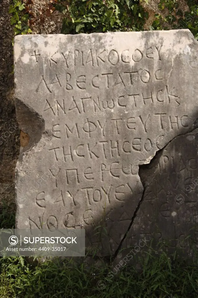 Greek Art. Slab with inscription at Phidias Workshop ruins, built in 430 BC to house the statue of Zeus. In the fifth century, Theodosius II turned the building into an early Christian church. Olympia. Greece.