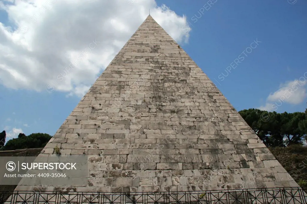 Roman Art. Pyramid of Cestius (Piramide di Caio Cestio). Ancient pyramid was built about 18 BC-12 BC. Tomb for Galius Cestius Epulo, magistrate roman. The pyramid was incorporated into the Aurelian Walls , and is close to Porta San Paolo (Porta Ostiensis) , on the right. Rome. Italy. Europe.