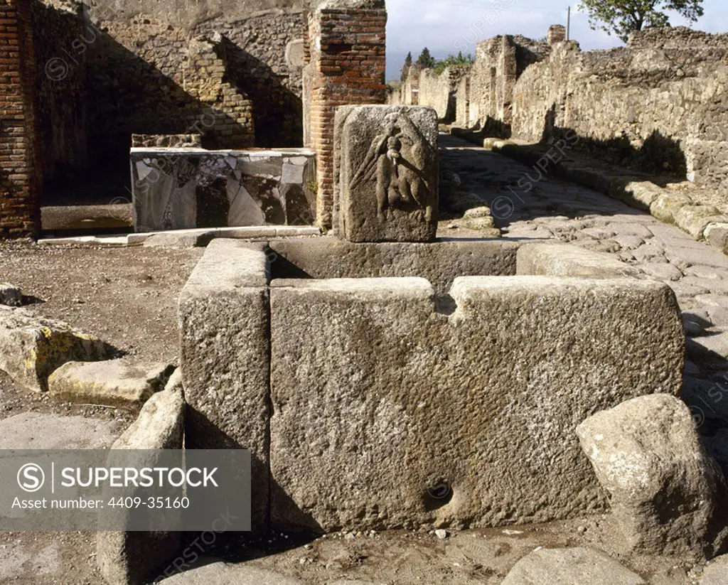 Pompeii. Public fountain in Via Vicolo di Modesto. Italy.