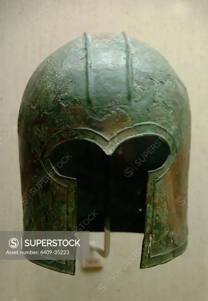 GREEK ART. Archaic bronze helmet of Corinthian type. Dated to 700-675 b.C. Museum of Cycladic and Ancient Greek Art. Athens. Greece.