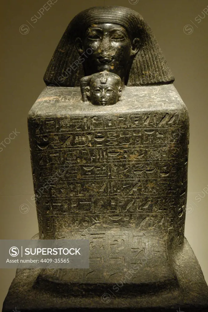 Egyptian Art. Statue-cube of Senenmut and Princess Neferure. Senenmut was architect and royal chancellor during the reign of Hatshepsut and guardian of her daughter, Neferure. Granite sculpture, from Thebes or Karnak. New Kingdom. 18th Dynasty. (1473-1458 B.C.). Egyptian Museum (Altes Museum). Berlin. Germany.