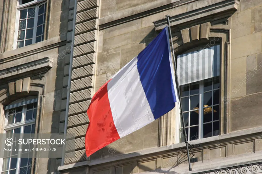 French Flag. Facade of Justice Palace. Paris. Francia. Europe.