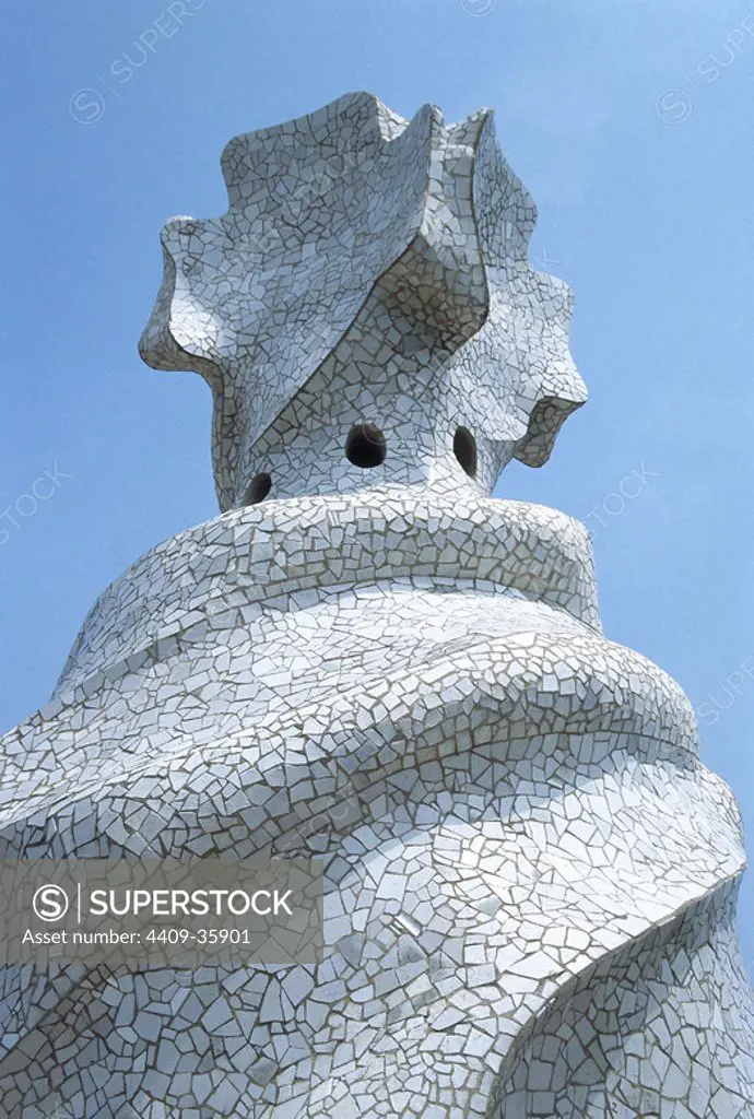 Gaudi, Antonio (1852-1926). Catalan architect. La Pedrera or Casa Mila (1905-1910). Roof detail lined with "trencadis" and enlivened by undulating forms. Barcelona. Catalonia. Spain.