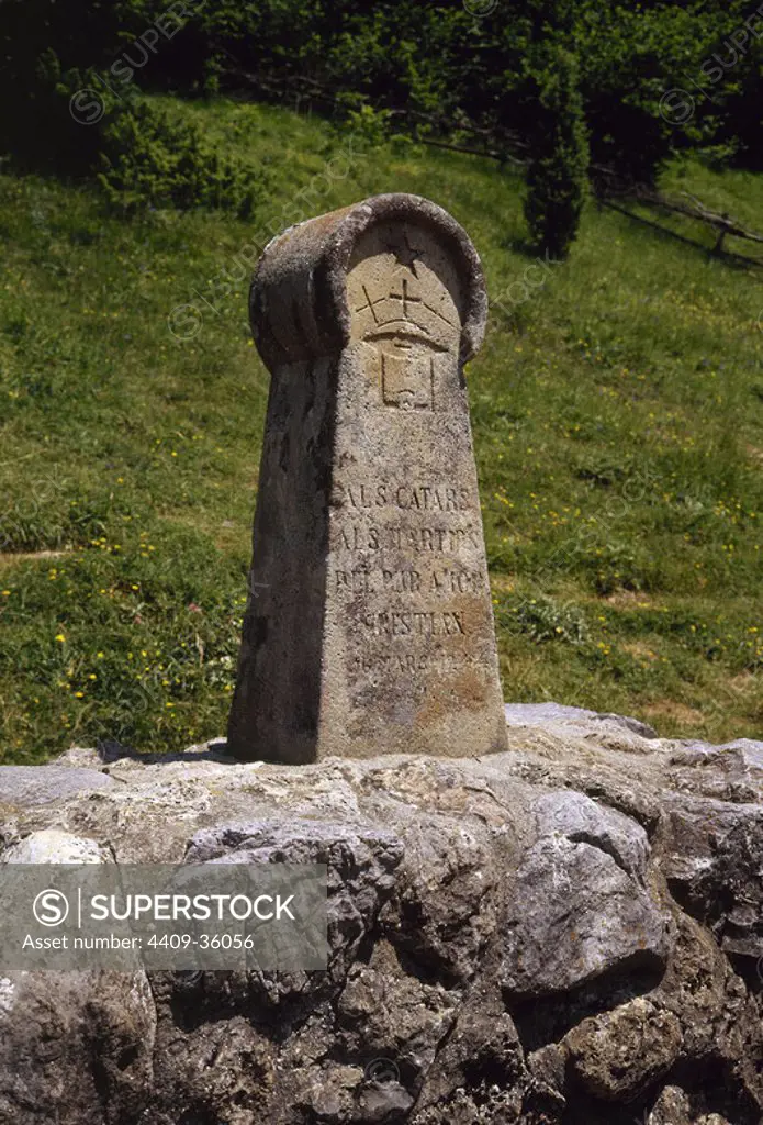 France. Medieval stele, erected in 1960, in memory of the Cathars were burned as heretics in the 13th century, after the crusade by Pope Innocent III. Meadow of Burned (Camp dels Cremats). Montsegur. Cathar Route.