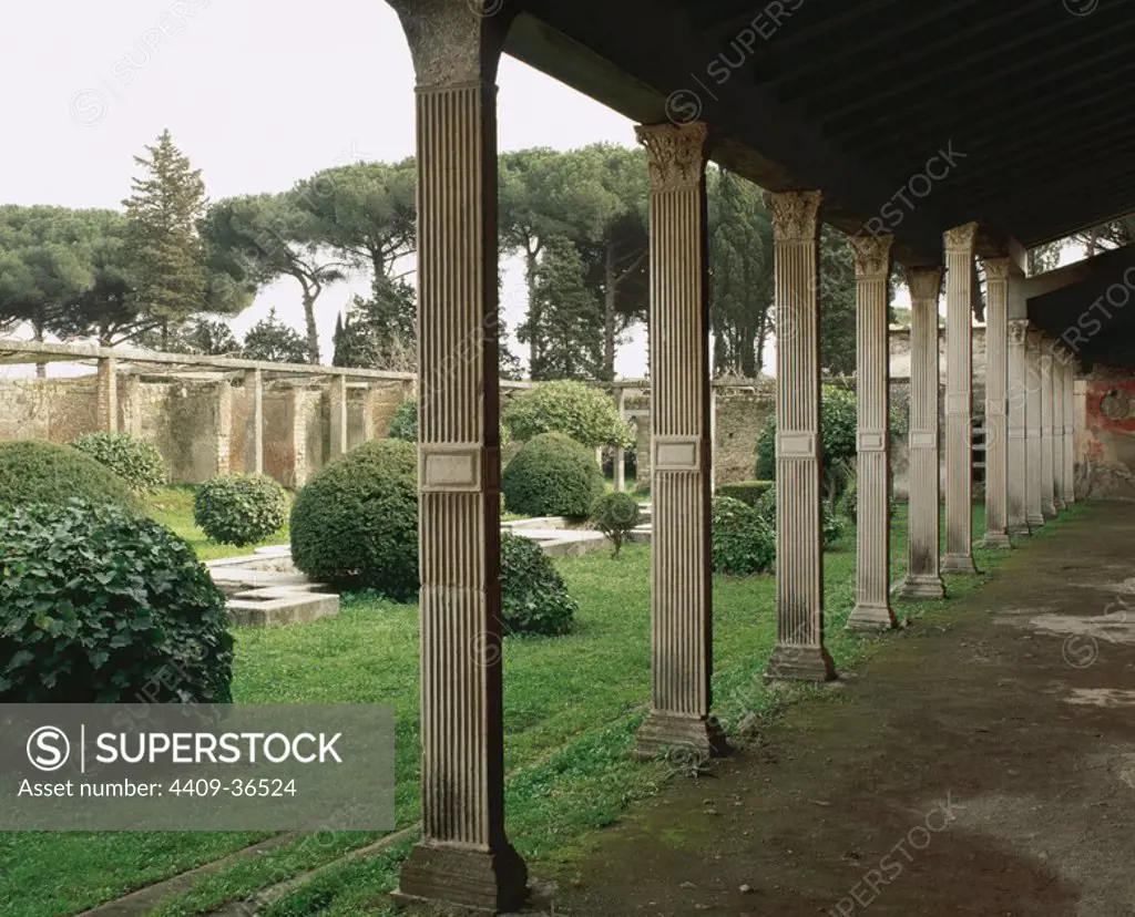 Italy. Pompeii.1st century AD. House of Julia. Garden surrounded by original marble-embellished quadrangular columns.