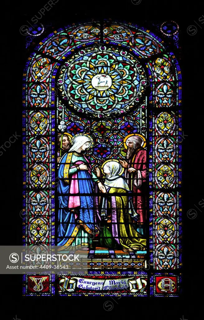 Stained glass window depicting The Visitation. Drawn by Enric Monserda_ (1850-1926) and fulfilled in workshops of Eudald Ramon Amigo (1828-1885). Abbey of Montserrat. Catalonia. Spain.