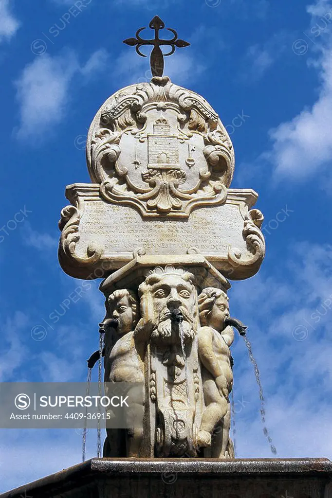 Spain. Region of Murcia. Totana. Baroque fountain made by Juan de Uceta, Pedro Litran and Juan Moreno in 1753. Topped by the coat of arms of the city and the Cross of the Order of Santiago. Constitution Square.