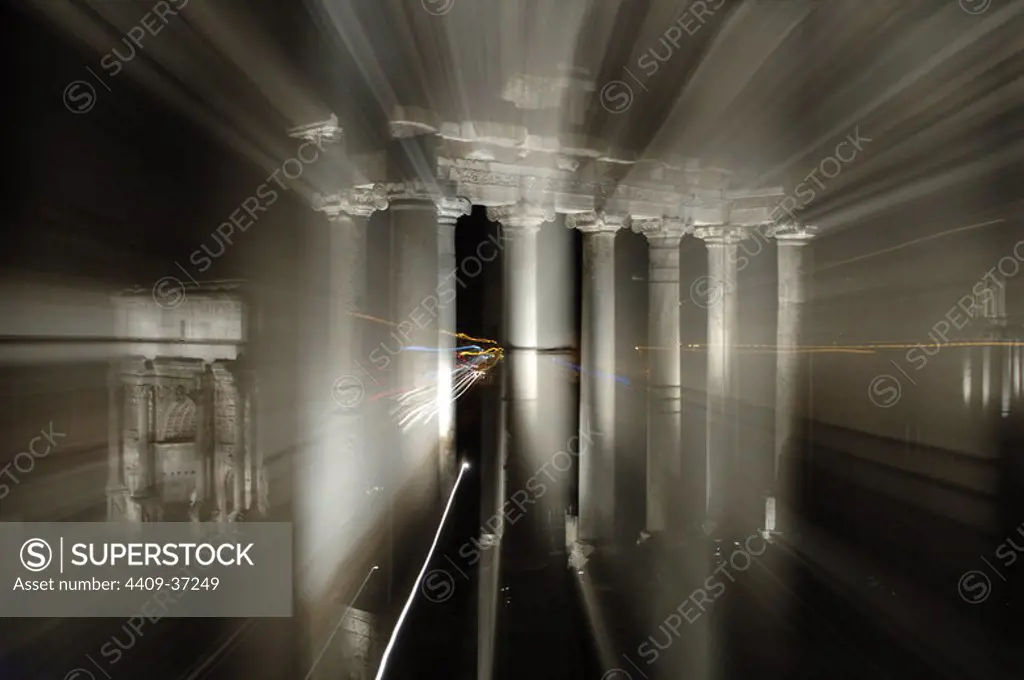 Italy. Rome. Roman Forum. Temple of Saturn, 5th century BC. Reconstructed in the 3rd century. Night view. Effects of lights.