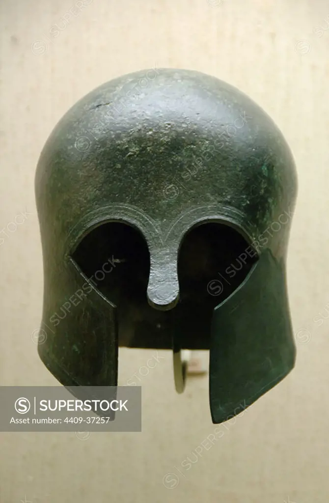 GREEK ART. Archaic bronze helmet of Corinthian type. Dated to 700-675 b.C. Museum of Cycladic and Ancient Greek Art. Athens. Greece.