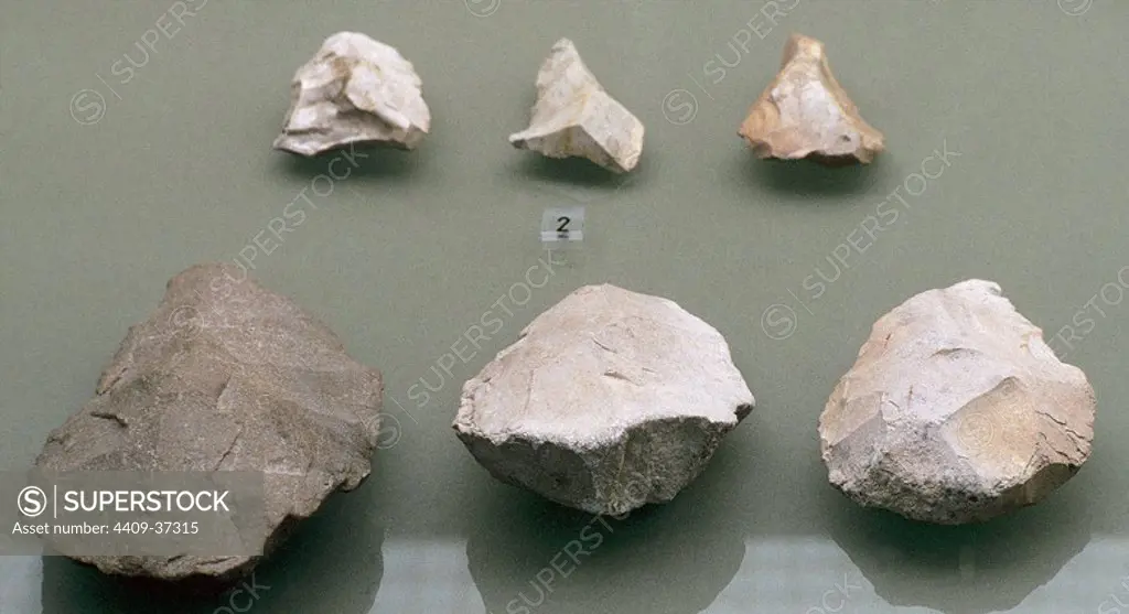 Prehistory. Middle Paleolithic or Mousterian (90,000 to 35,000 BC). Quartzite cleaver and bifaces of Aranzaduya (Urbasa). Museum of Navarre. Pamplona. Spain.