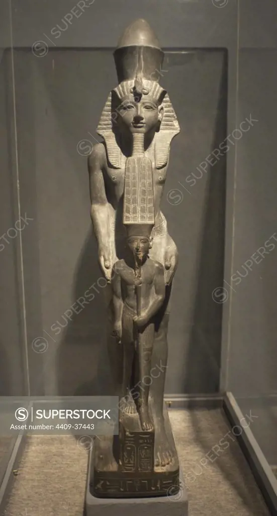 Egyptian art. Pharaoh Ramses IV next to god Amun. 20th Dynasty. New Kingdom. Luxor Museum. Egypt.