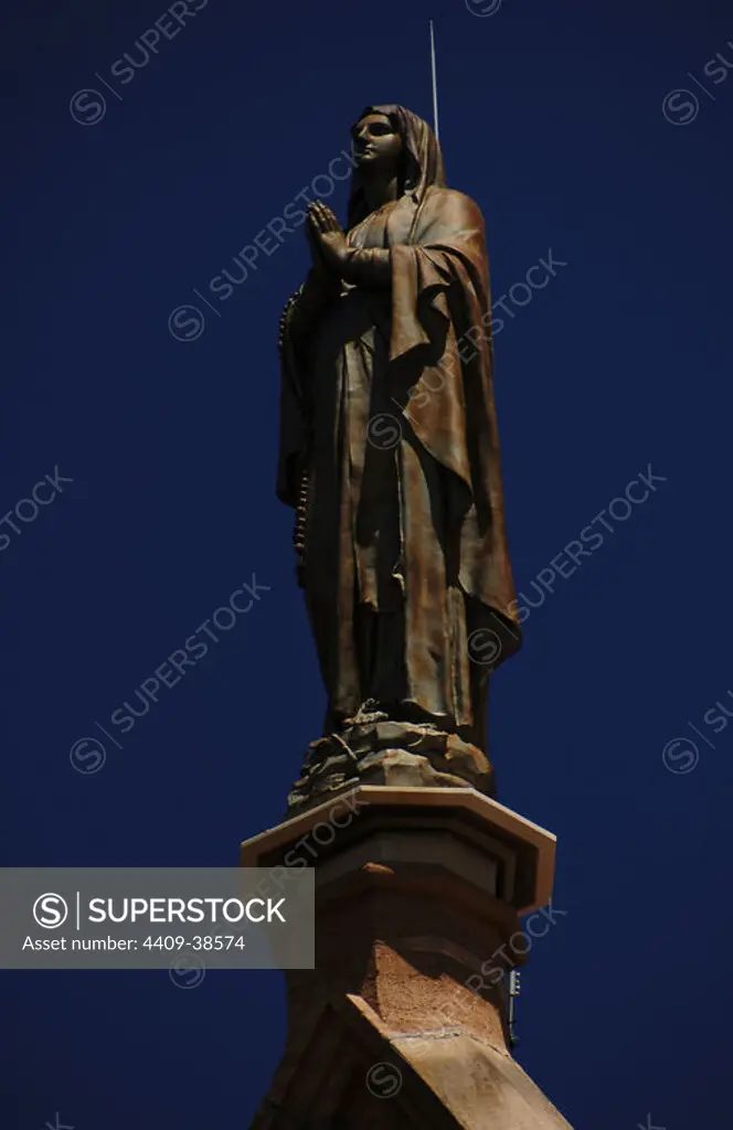 United States. Santa Fe. Loretto Chapel. 19th century. Statue of Virgin Mary at the top. State of New Mexico.