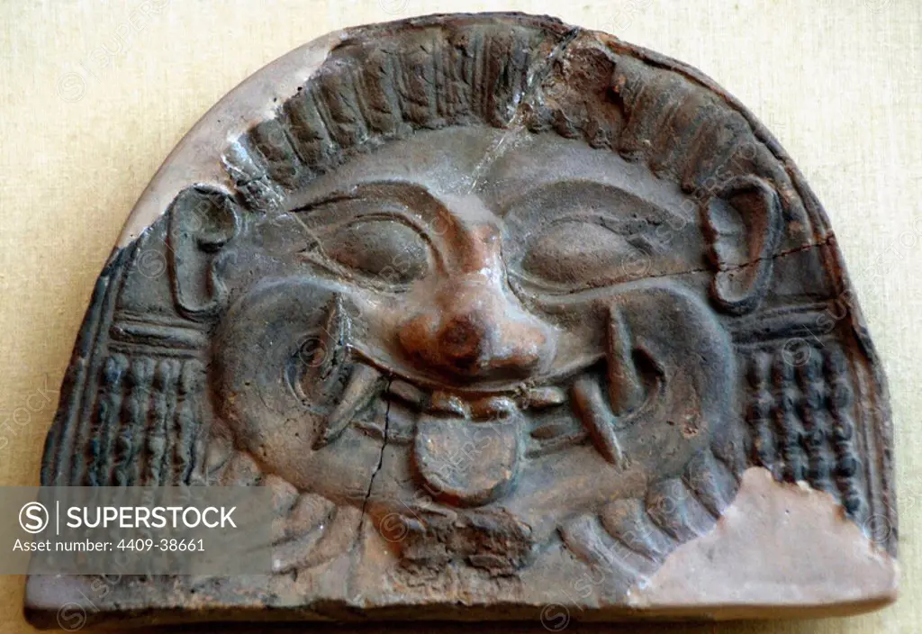 Terracota antefix tarantini that represents the head of a Gorgon. Late VI century early V century B.C. Museum of Fine Arts. Budapest. Hungary.