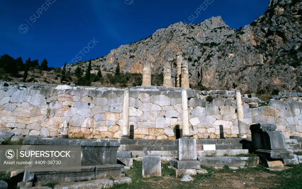Greek Art. Greece. Delphi. The Stoa of the Athenians. Ancient building in the Sanctuary of Apollo. It was constructed c. 478-470 B.C. Early Classical period. In the background, the Doric columns of the Temple of Apollo.