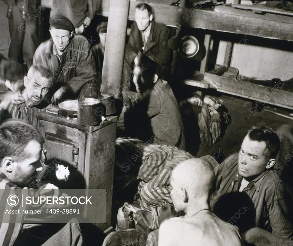 WORLD WAR II. Sandbostel Concentration Camp. Political prisoners and British troops inside a bunkhouse in STALAG XB camp. Germany.