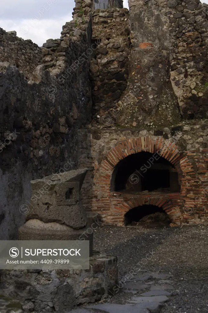 Italy. Pompeii. Pistrium. Oven for bread, old-mill of grain and the fireplace of the oven.