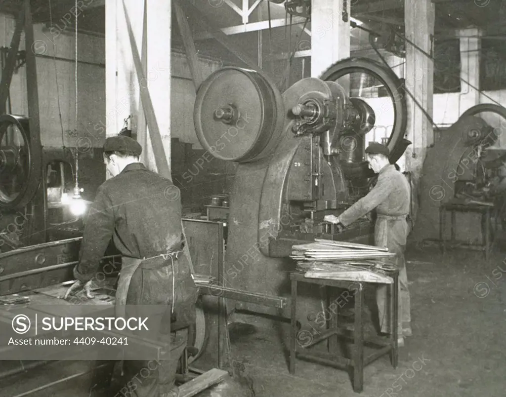 Spanish Industry, 1945. Production line of a company dedicated to the manufacture of motorcycle components. Metal stamping, presses section. Spain, Catalonia, Barcelona.