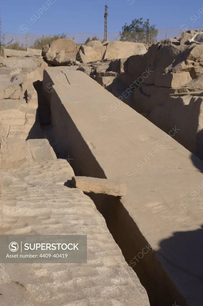 Egypt. Aswan. The unfinished obelisk in a granite quarry. The bottom side is still attached to the bedrock and it presents the marks from workers' tools.