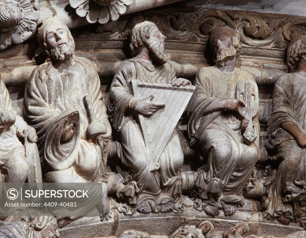 Santiago de Compostela Cathedral. The Portal of Glory. Romanesque style, by Master Mateo, 1168-1188. Central archivolt., detail. 24 Elders of the Apocalypse. Each one is holding a musical instrument. From right to left: Elderly holding a redoma or flask (perfume bottle), harp-psaltery and oval viola. Province of La Corun_a, Galicia, Spain.
