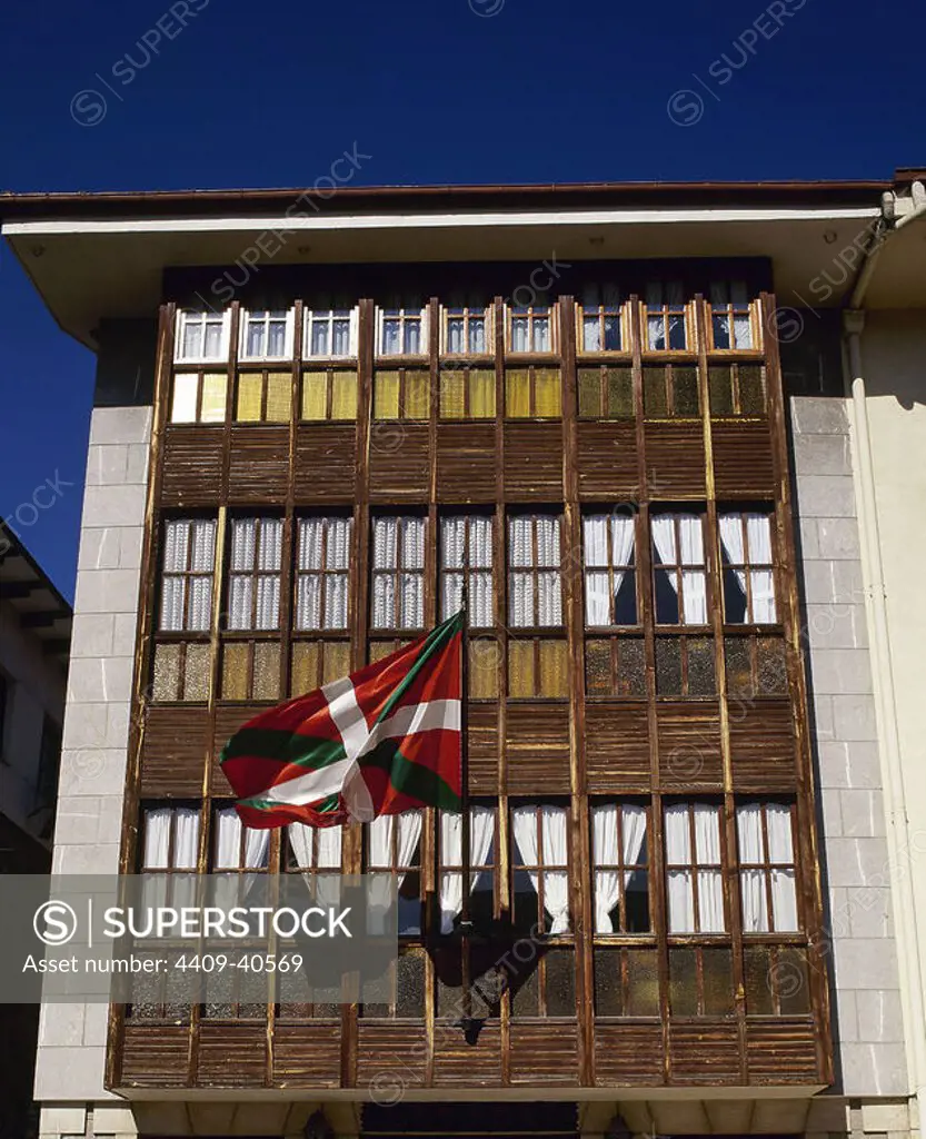 Spain. Basque Country. Orozco. Detail of balcony with Basque flag.