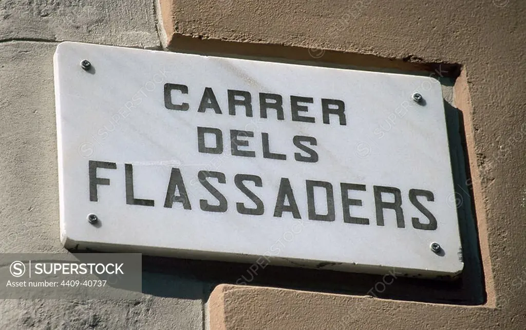 Urban nomenclator in catalan language. Flassaders Street. Barcelona. Catalonia. Spain.