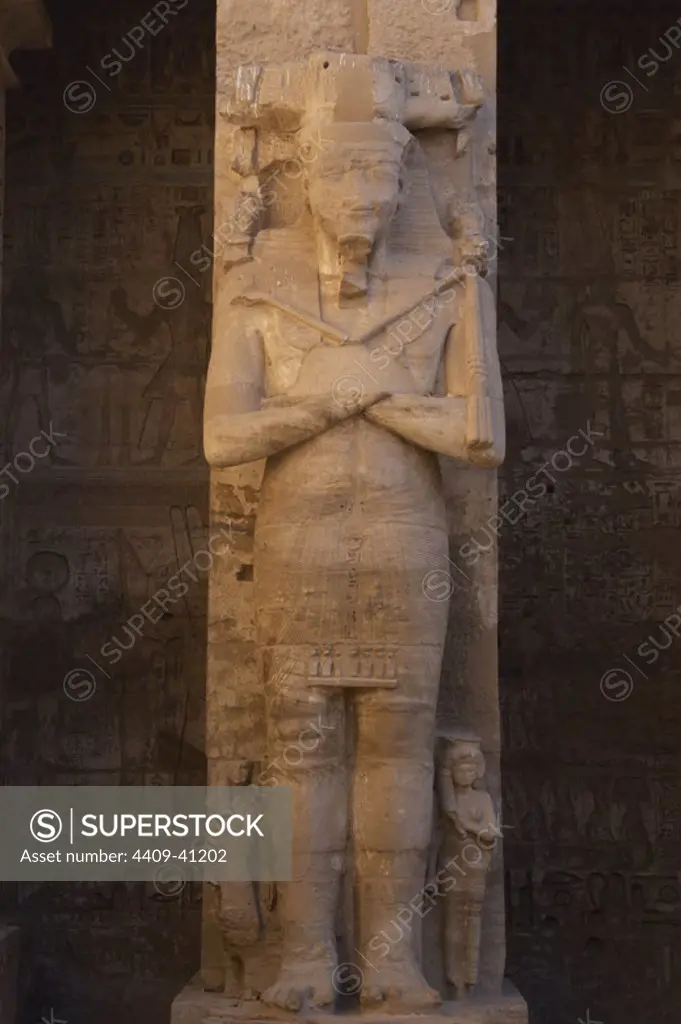 Temple of Ramses III. Great colossal statues of Ramses III deified as Osiris, attached to pillars. New Kingdom. (1550-1069 b.C). Twentieth dynasty. Thebes. Medinet-Habou. Egypt..