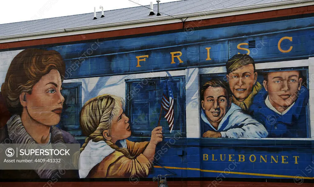 Wall painting depicting a mother and daughter farewelling to soldiers who participated in World War II. The Gold Star Boys on the Blue Bonnet train, which conducted the transportation of the soldiers. By Michelle Loughery (b.1961). Series of murals depicting historical scenes of both local and national themes. Cuba, State of Missouri, United States. Author: Michelle Loughery (b.1961). Canadian muralist.