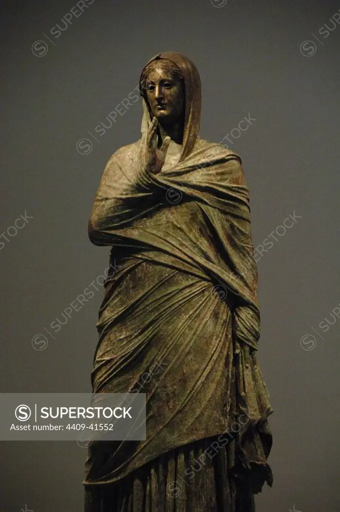 Greek Art. The lady of Kalymnos. Bronze statue. Found by a fisherman on the Sea of __Kalymnos in late 1994. Probably belongs to the Hellenistic Period, perhaps late 2nd century B.C. National Archaeological Museum. Athens. Greece.