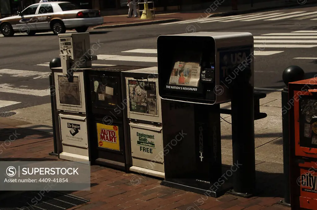 United States. Pennsylvania. Philadelphia. Newspaper sale machines in Market street.