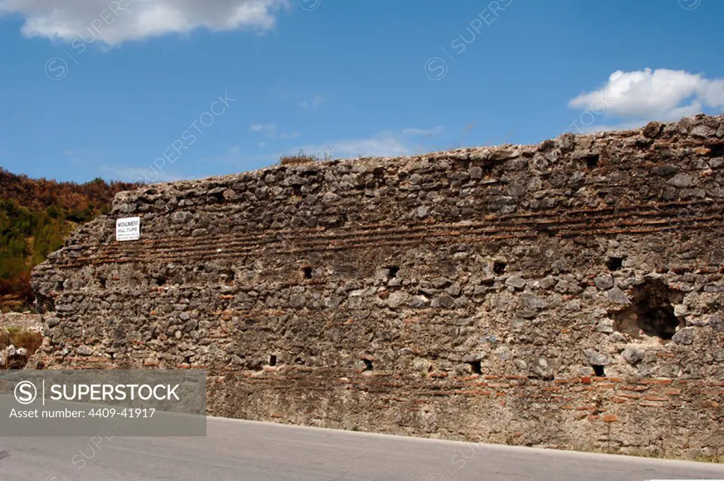 REPUBLIC OF ALBANIA. Stretch of wall along the road between Saranda and Mesopotam.