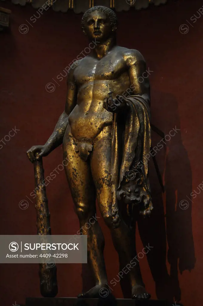 Hercules with mallet, skin of the Nemean lion and golden apples. Colossal gilded bronze statue. Sculpted probably between 1st and 2nd centuries A.D. Found near Campo dei Fiori in 1864. Pio-Clementino Museum. Vatican Museums.