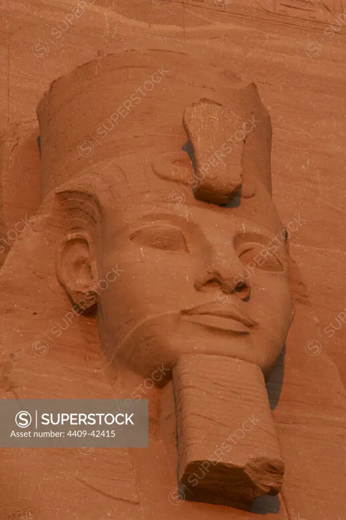 Egyptian art. Great Temple of Ramses II. Colossal statues depicting the pharaoh Ramses II (1290-1224 BC) seated with the nemes head and surmounted by the double crown. 19th Dynasty. New Kingdom. Abu Simbel. Egypt.