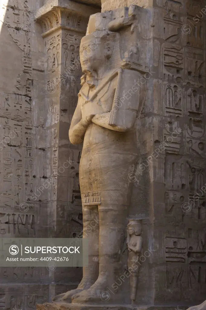 Temple of Ramses III. Great colossal statues of Ramses III deified as Osiris, attached to pillars. New Kingdom. (1550-1069 b.C). Twentieth dynasty. Thebes. Medinet-Habou. Egypt.