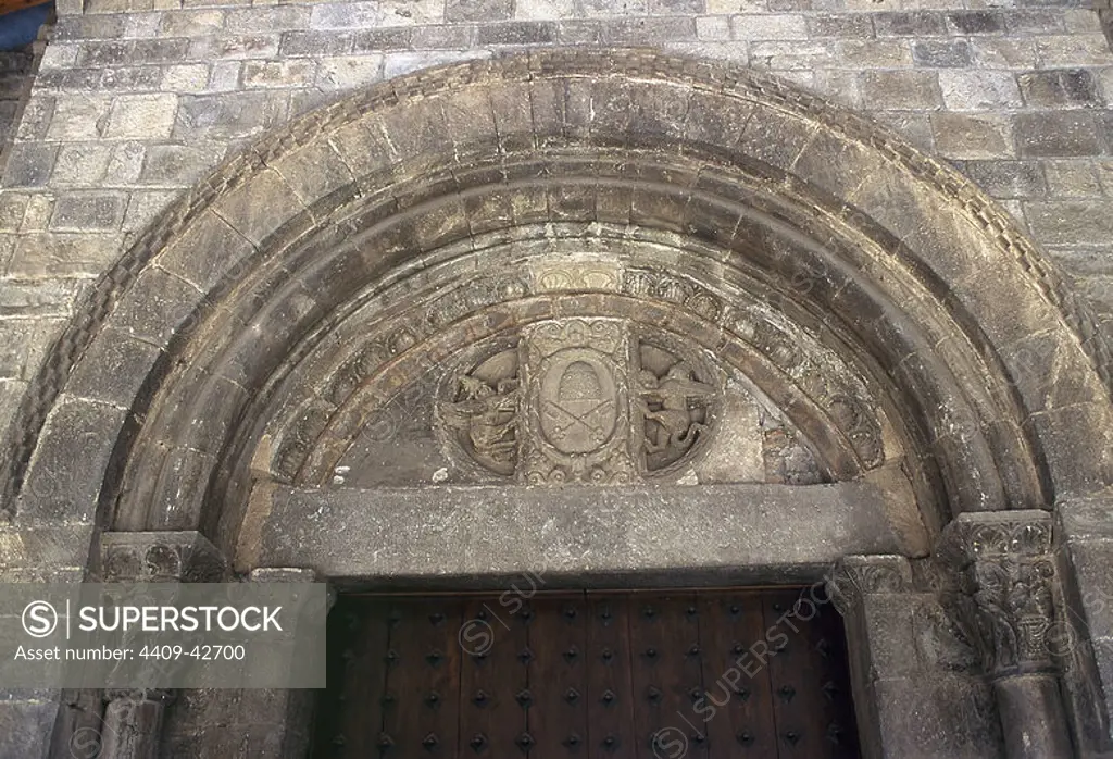Saint Peter's Cathedral. Romanesque temple built during the kingdom of Ramiro I (1035-1063), king of Aragon. XI century. South porch with a later shield of the Papal States in the tympanum. Jaca. Aragon. Spain.