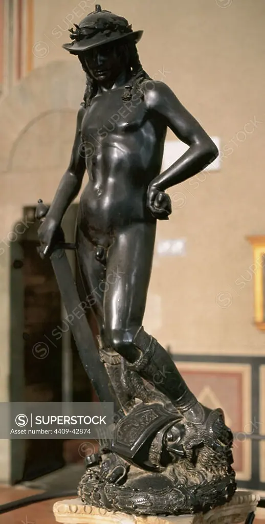 Donatello (1386-1466). Renaissance italian sculptor. David. Bronze statue sculpted between 1430 and 1440. It depicts David posed with his foot on Goliath's head after defeateing the giant. Bargello Museum. Florence. Italy.
