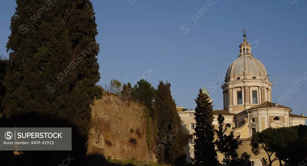 The Mausoleum of Augustus. Tomb built by the Roman Emperor Augustus in 28 BC. Campus Martius. At the background, the church of San Carlo al Corso. Rome, Italy.