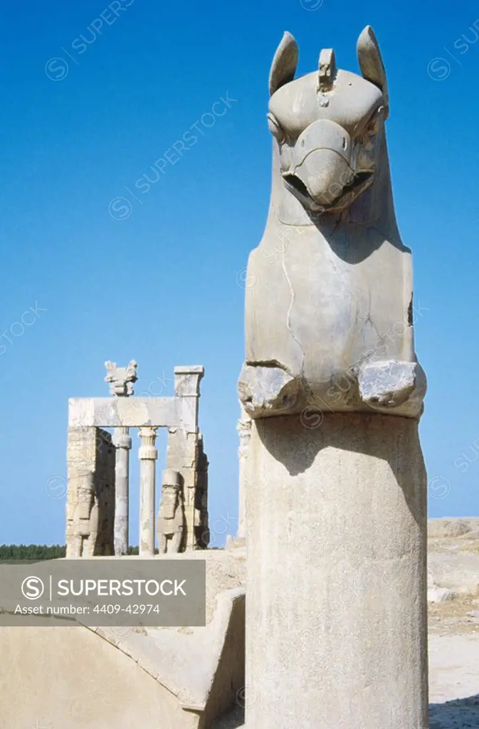 Persian Art. Achaemenid period. Persepolis (Takht-e-Jamshid). Capital with a griffin, dated during the reign of Xerxes (486-465 BC). In the background, the Gate of all Nations or Gate of Xerxes. Islamic Republic of Iran.
