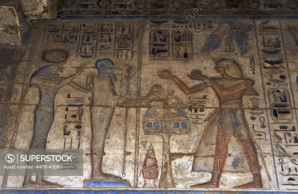 Temple of Ramses III. The pharaoh making offerings before goddess Tefnut and god Ptah. Relief. New Kingdom. (1550-1069 b.C). Twentieth dynasty. Thebes. Medinet-Habou. Egypt.